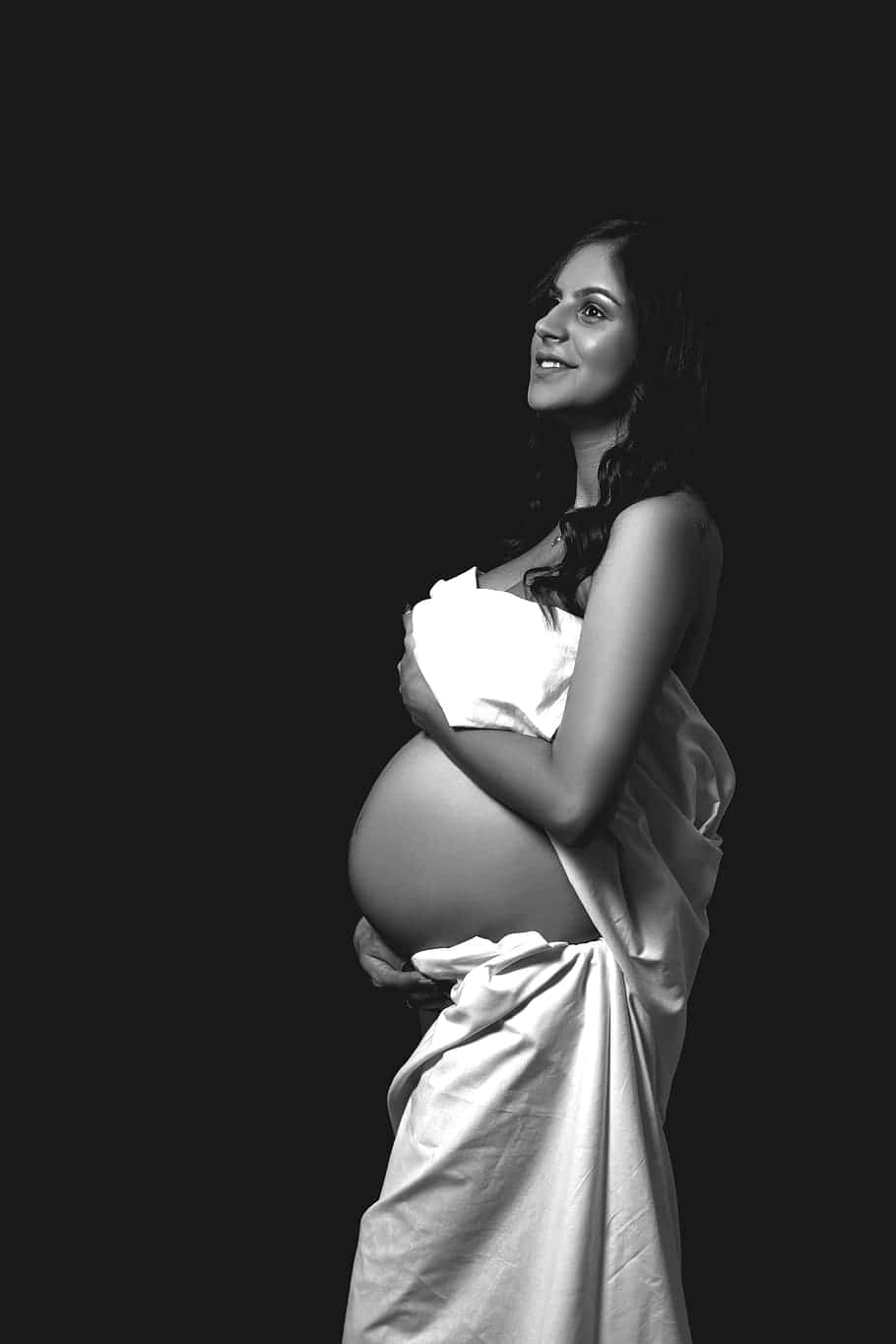 Pregnant Woman Embracing Her Belly