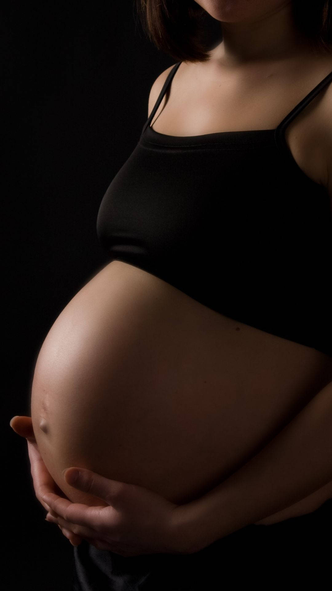 Pregnancy Baby Bump Black Background Wallpaper