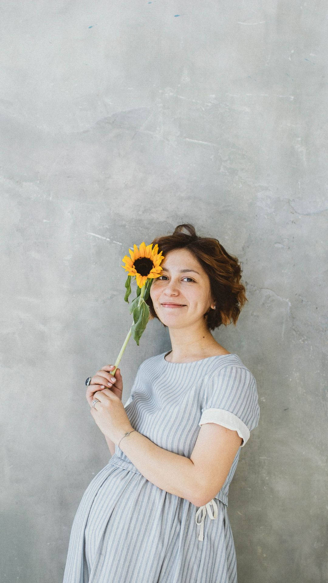 Pregnancy Woman Holding Sunflower Background