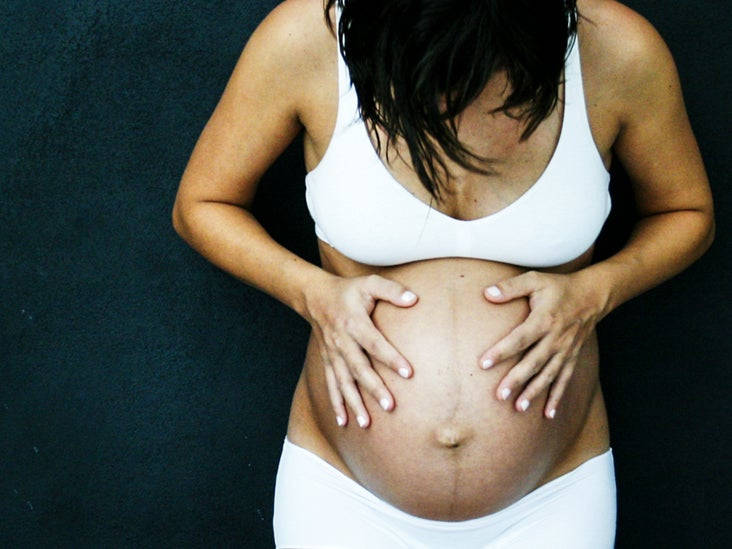 Barrigade Embarazada Sosteniendo Su Vientre. Fondo de pantalla