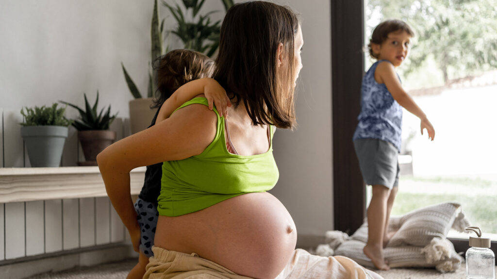Pregnant Belly Mother Playing With Kids Wallpaper