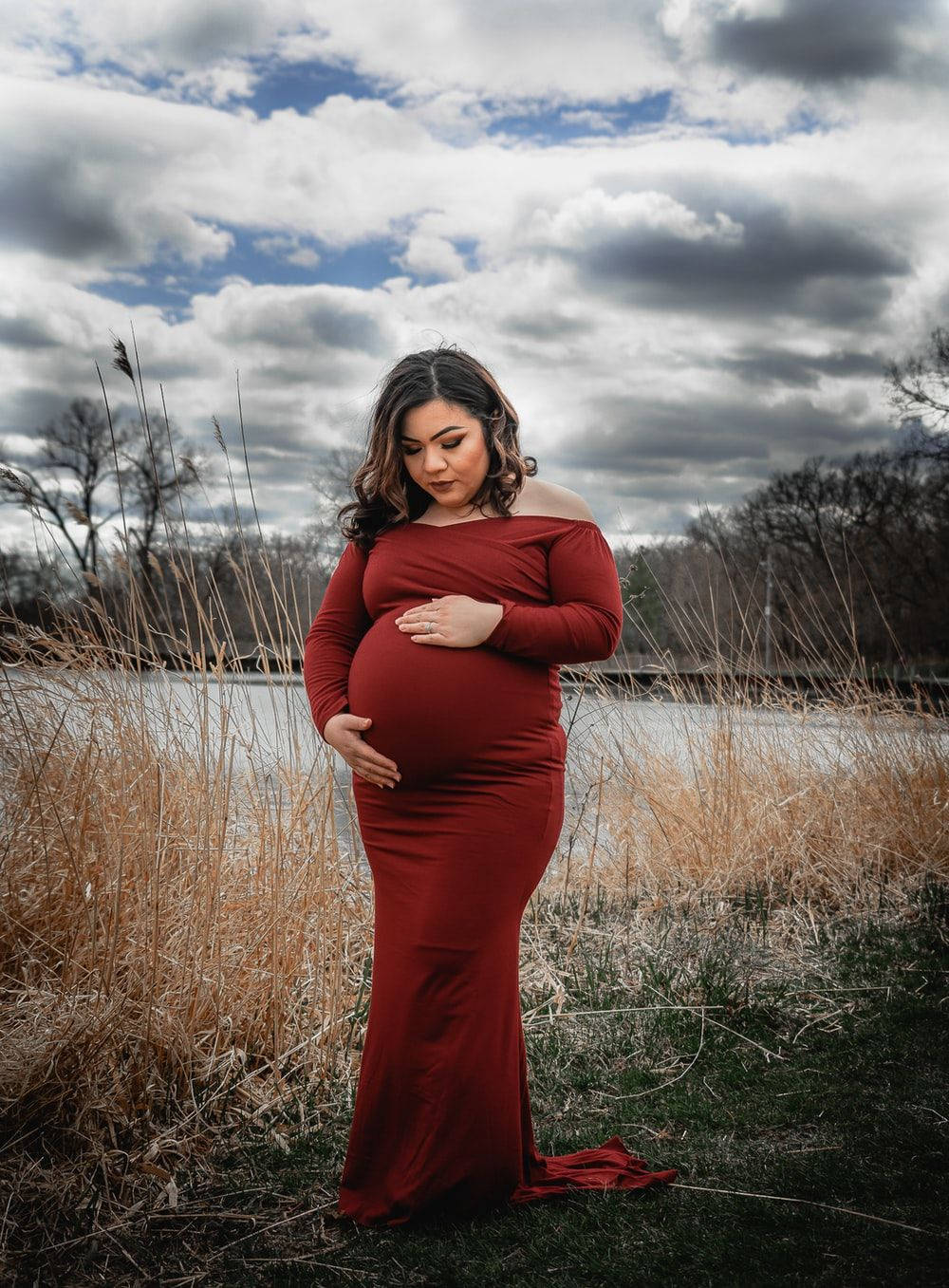 Download Pregnant Belly Red Dress Outside Wallpaper
