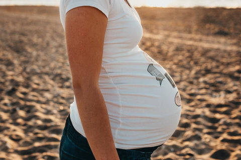 Pregnant Belly Sandy Background Wallpaper