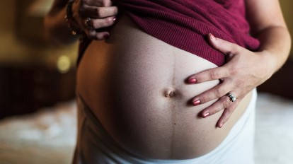 Pregnant Belly Woman Maroon Shirt Wallpaper