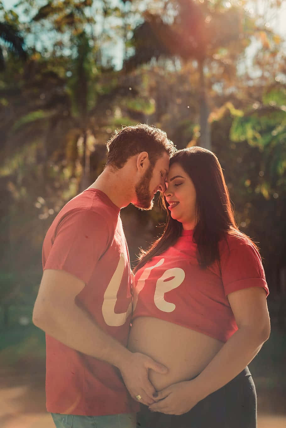 Pregnant Couple Shirt On Sunny Day Wallpaper