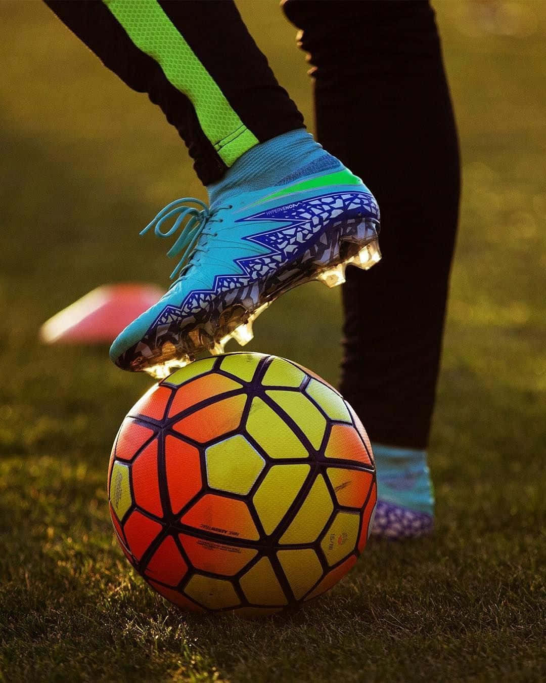 Premier League In Action - A Dynamic Display Of Soccer Cleats Wallpaper