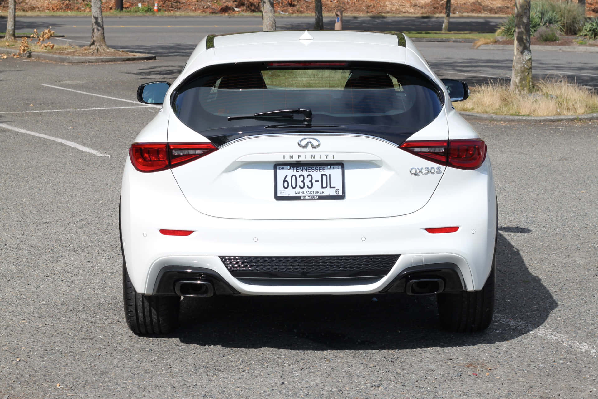 Premium Infiniti Qx30 In A Scenic Highway Setting Wallpaper