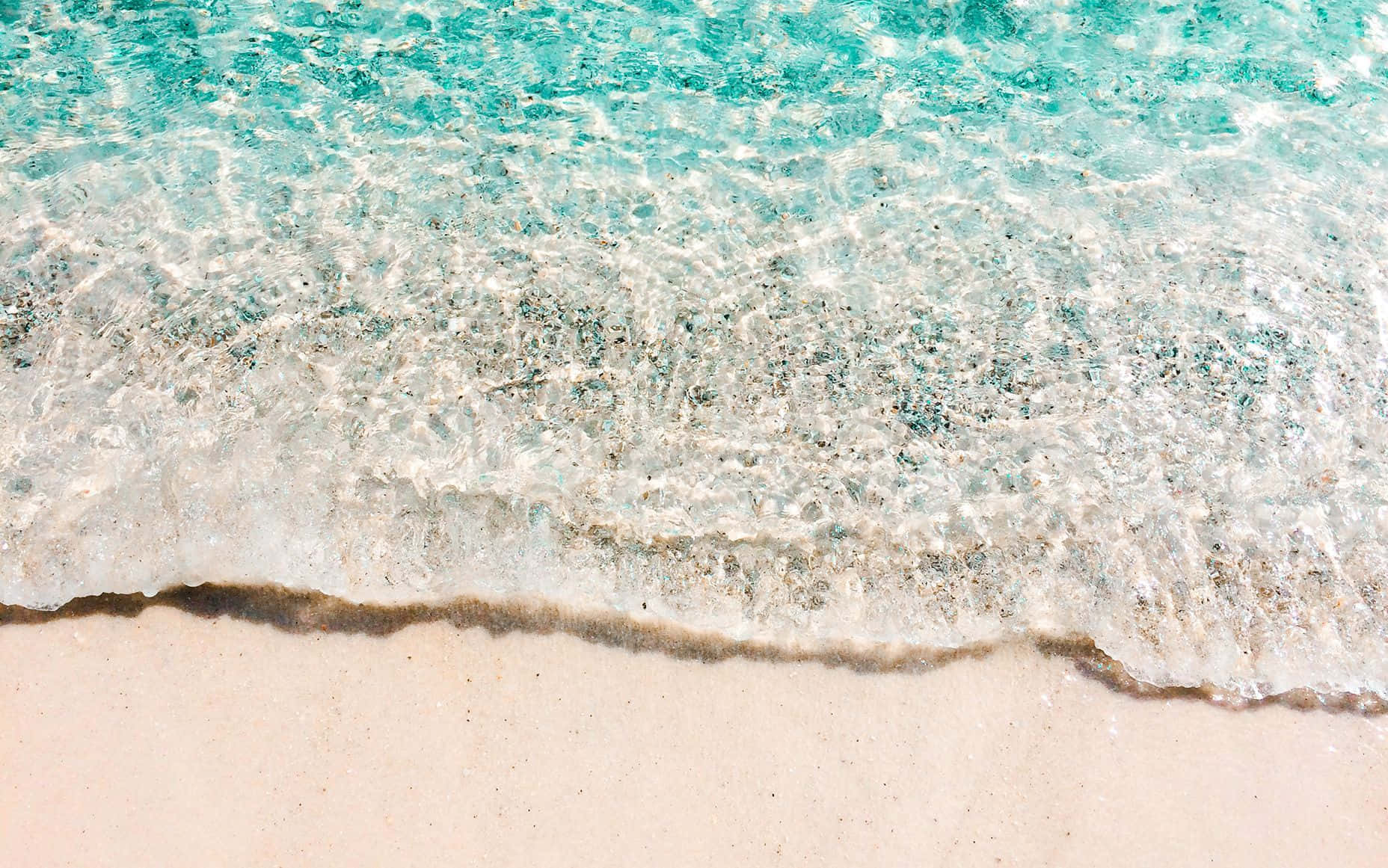 Preppy Beach Aesthetic_ Waves On Sandy Shore.jpg Wallpaper