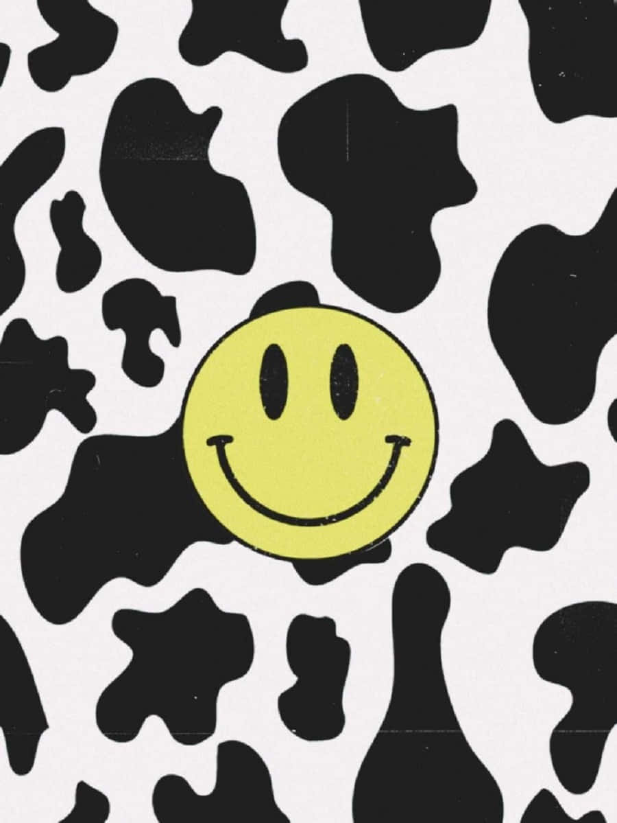 A Black And White Cow Print With A Smiley Face