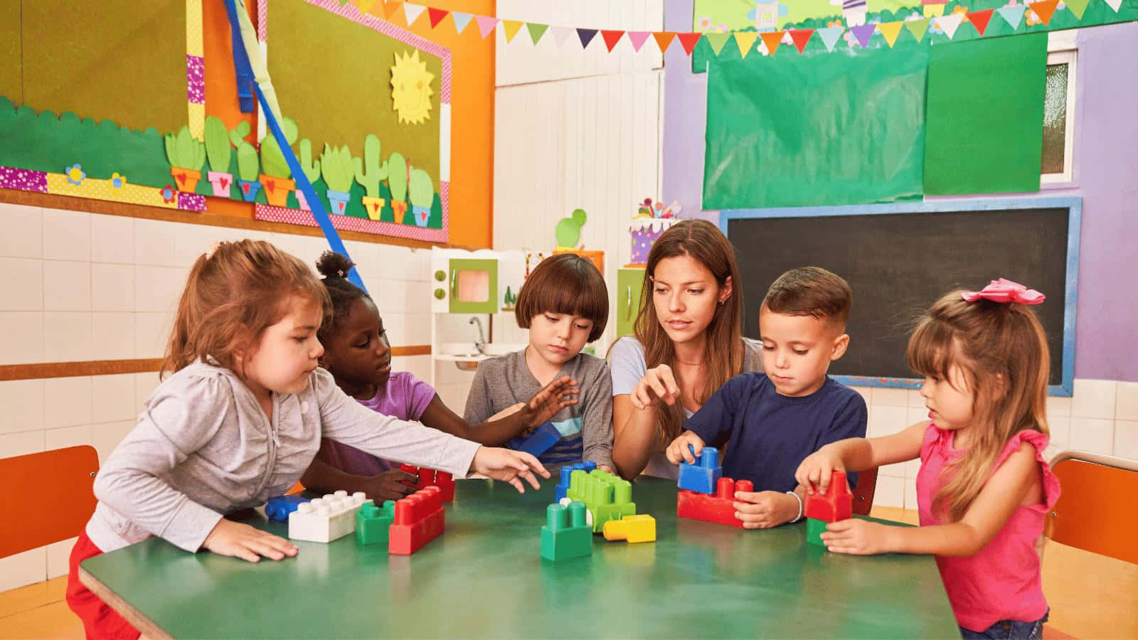 Preschool Learning Activity With Teacher Wallpaper