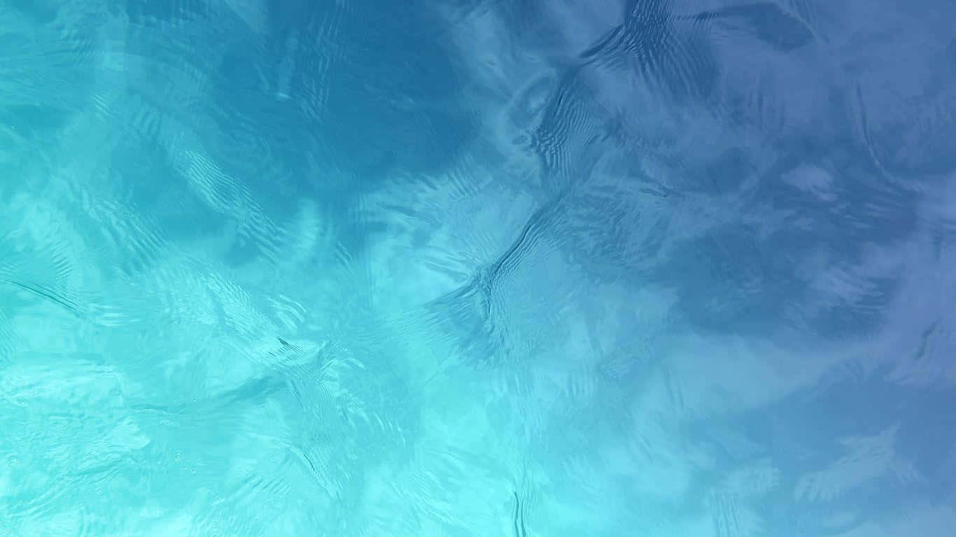 A Blue And Green Water Surface