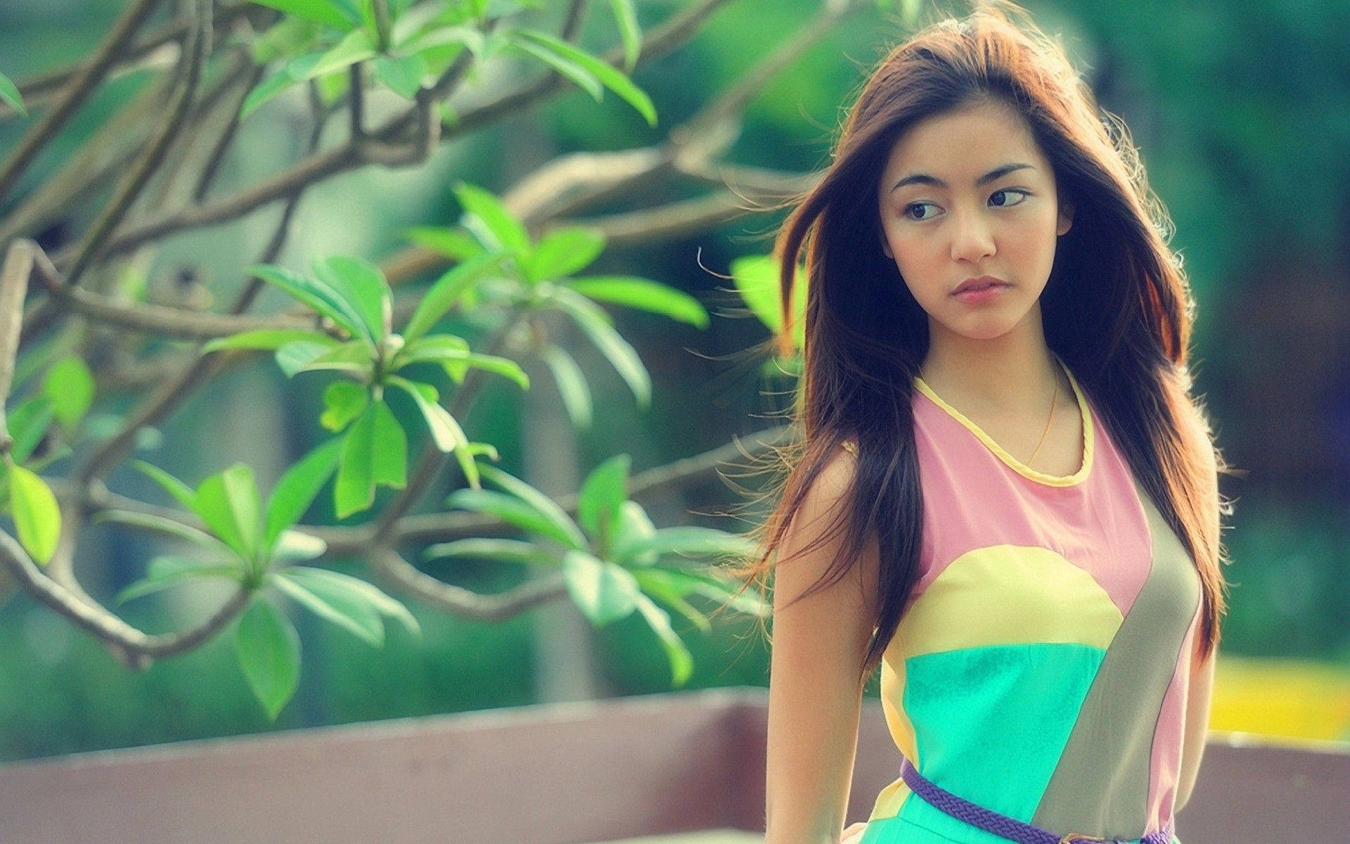 Pretty Asian Woman Wearing Colorful Dress Wallpaper