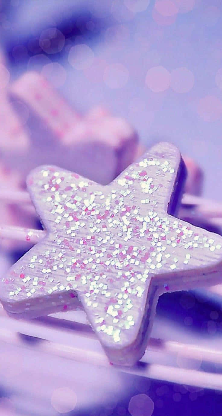A Star Shaped Cookie On A Purple Background Wallpaper