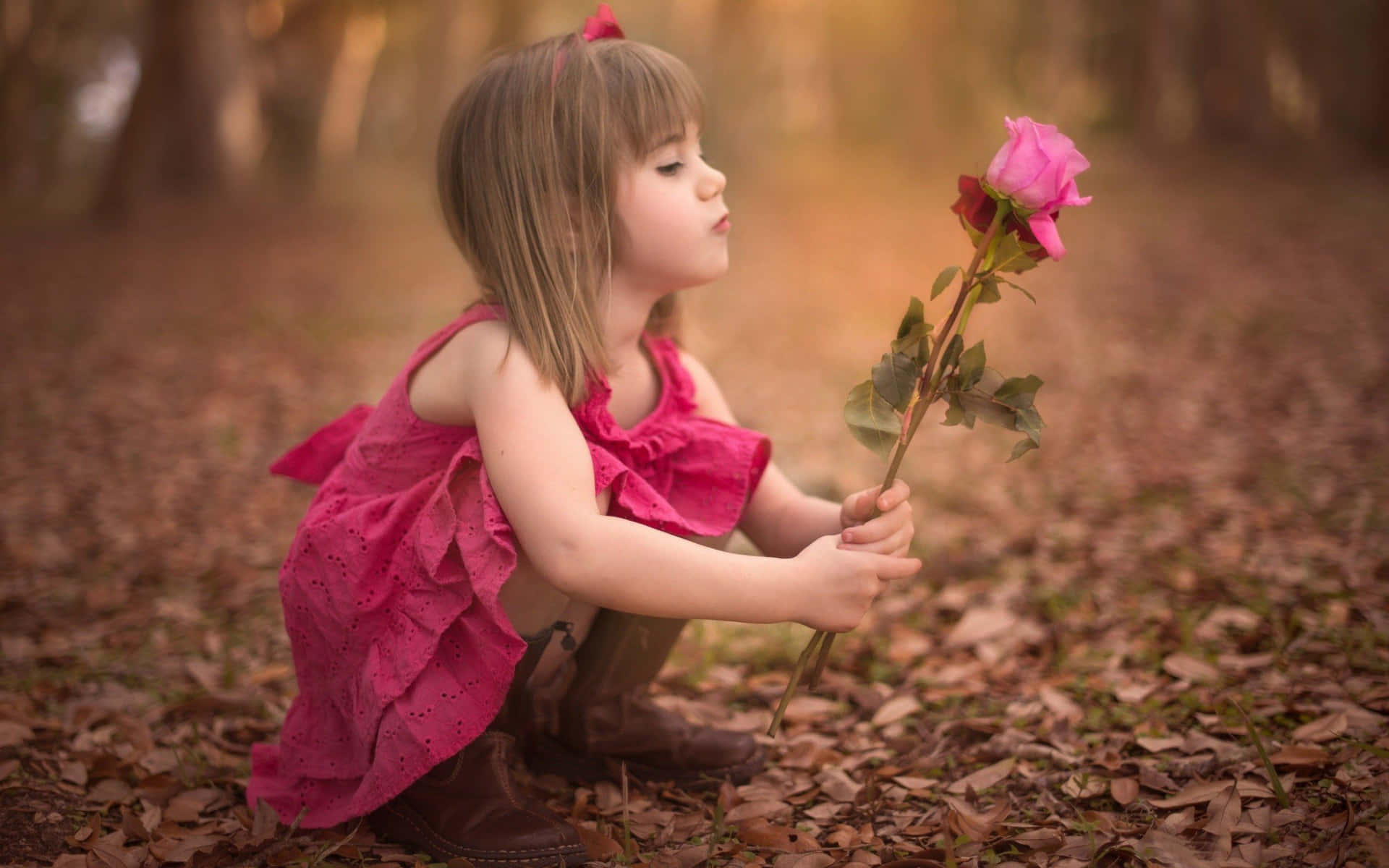 Smuk lille pige med roser Wallpaper