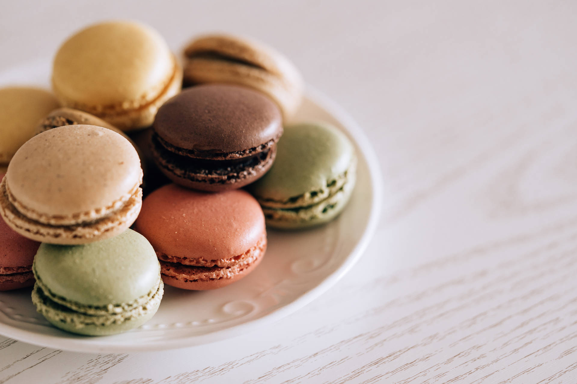 Pretty Pastel Macaroons On Plate Wallpaper