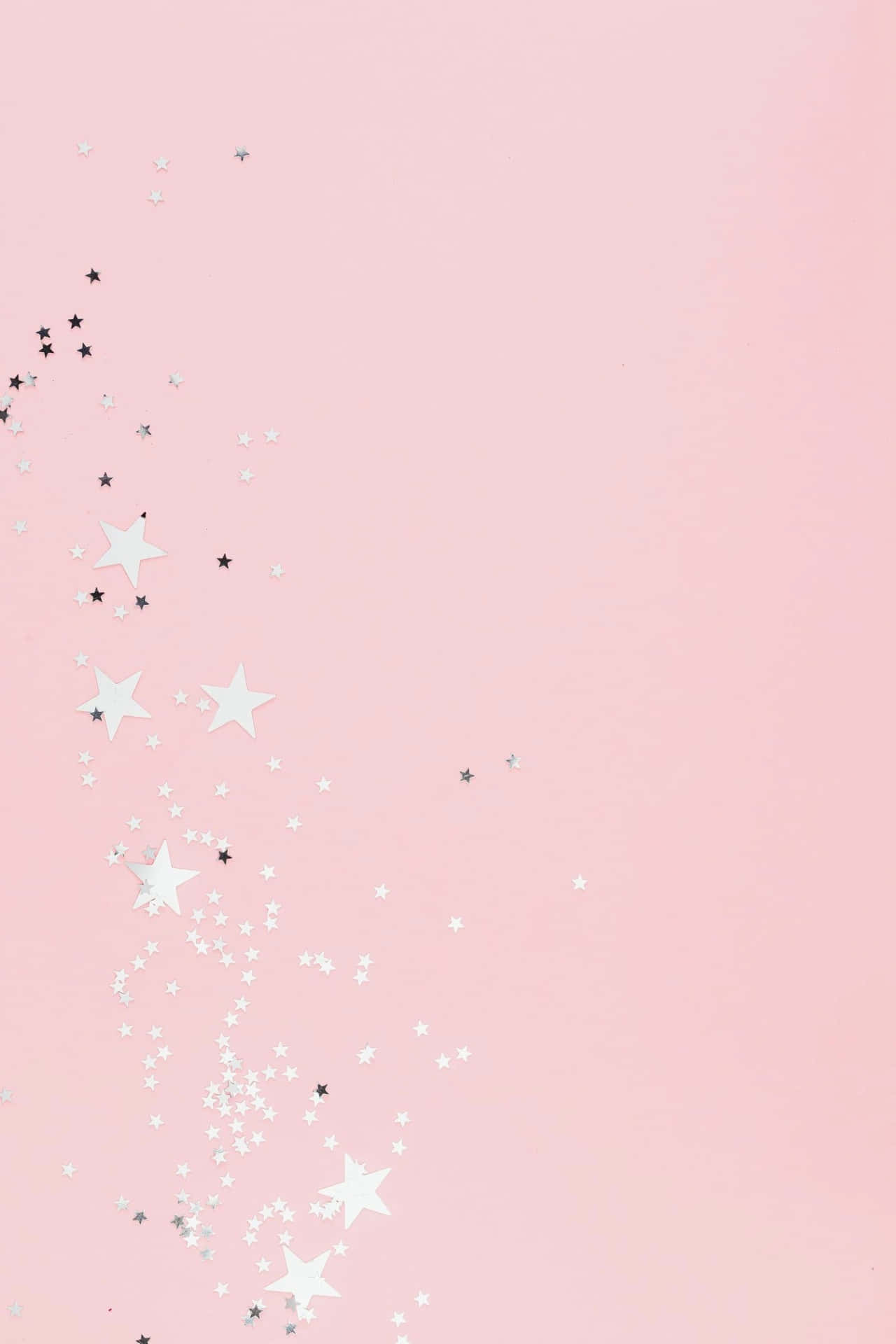 A Pink Background With Stars And Glitter