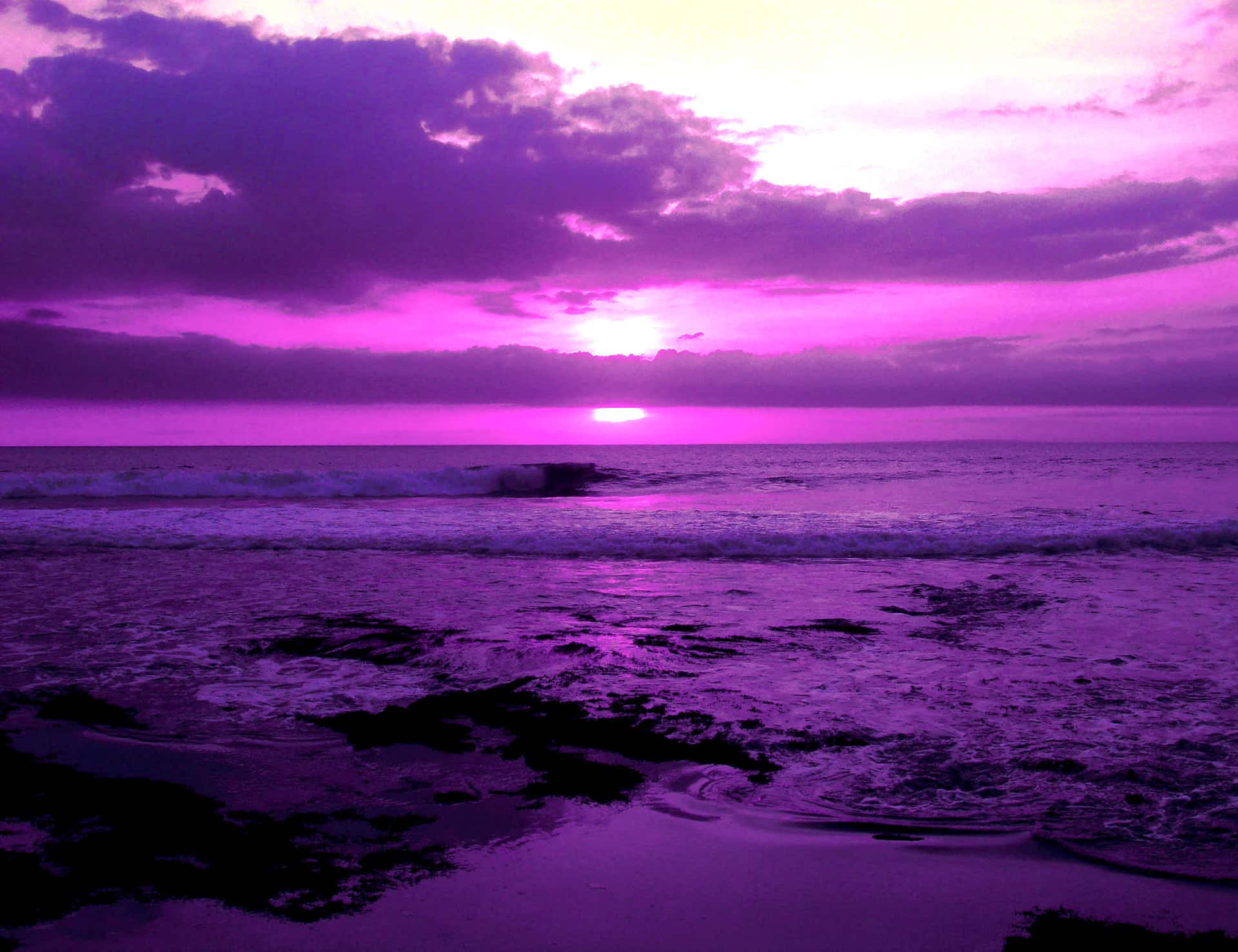 Pretty Purple Of A Beach Sunset Wallpaper