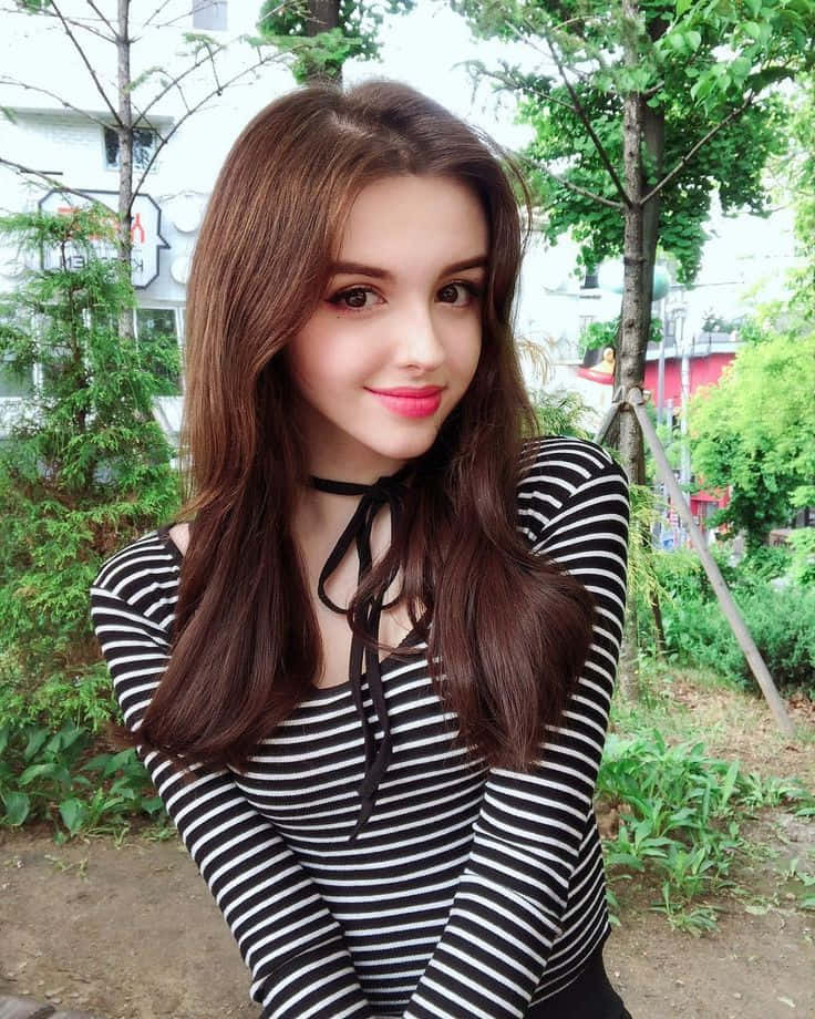 Pretty Teen Girl In Stripes Background