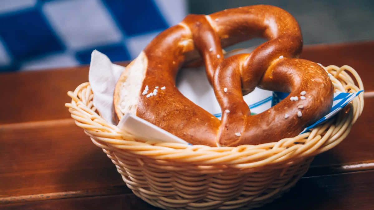 A Pretzel In A Basket On A Wooden Table