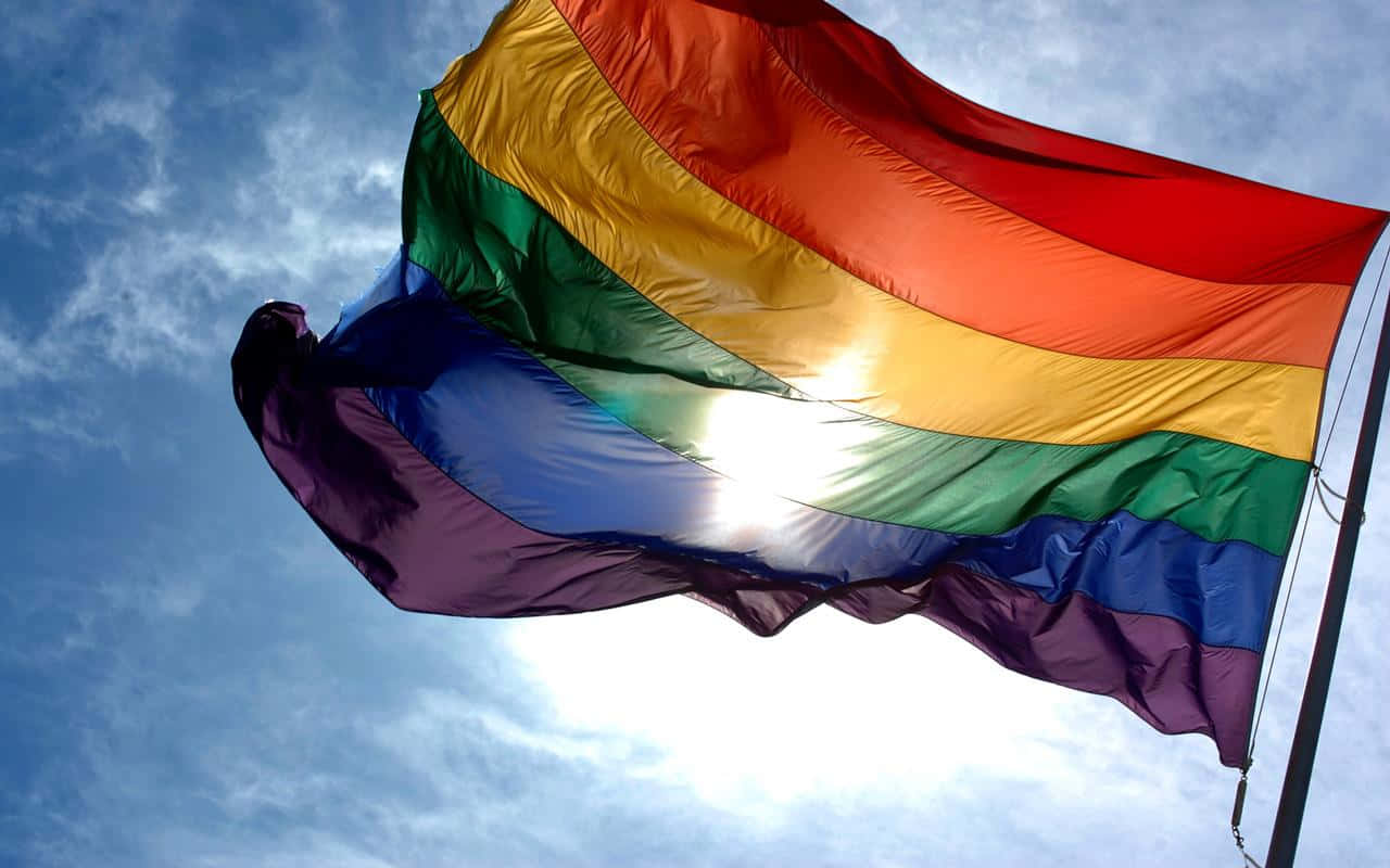 Rainbow Flag In Blue Sky Pride Desktop Wallpaper