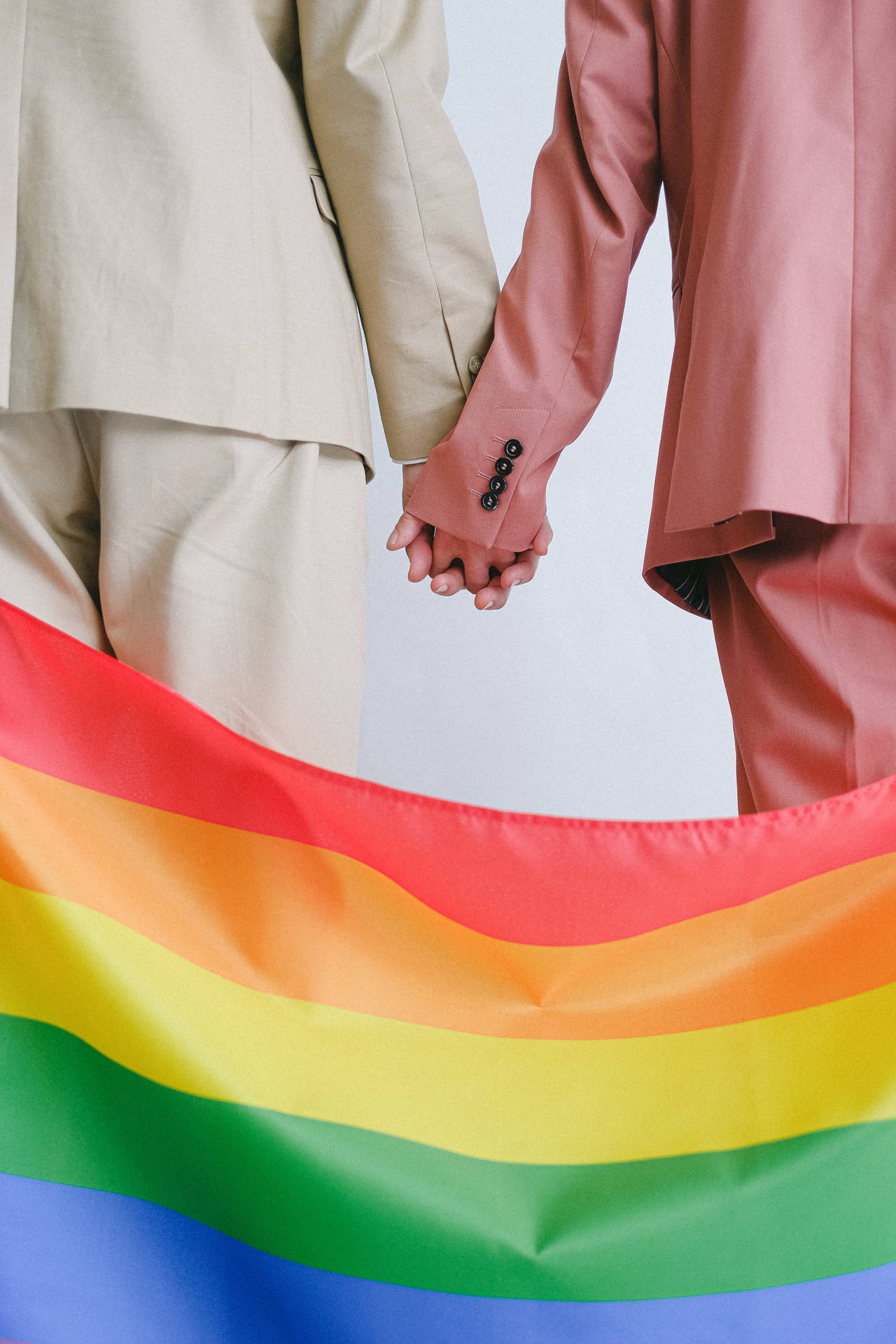 Pride Flag Couple In Suits Wallpaper