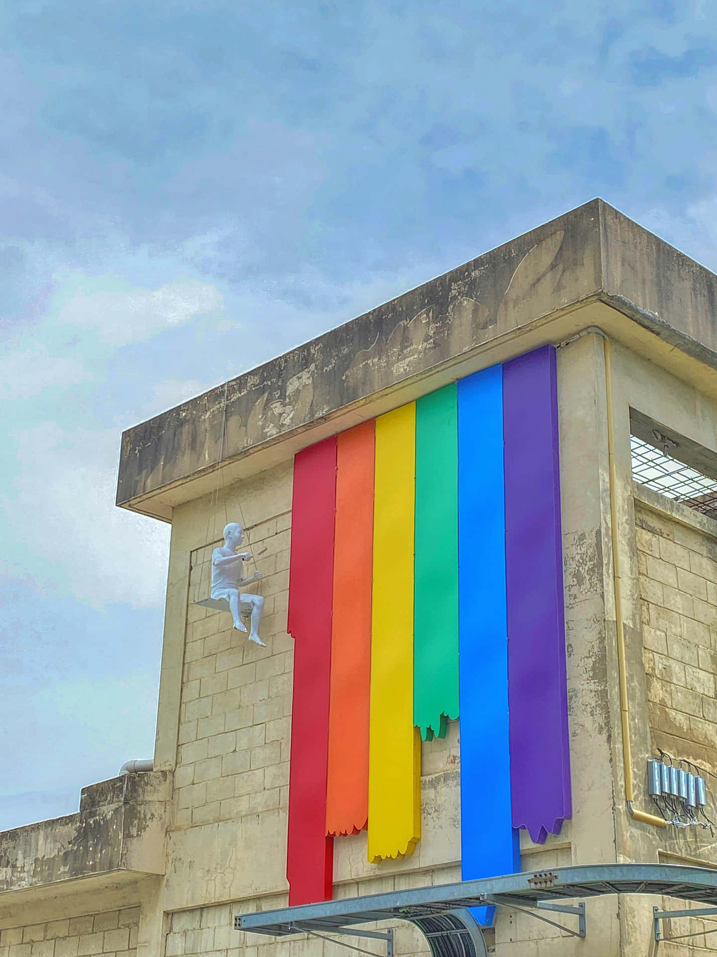 Pride_ Flag_ Display_on_ Building Wallpaper