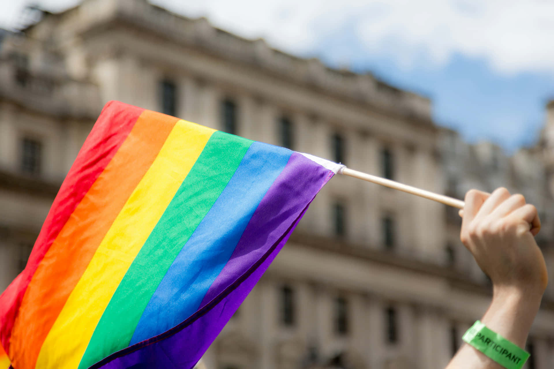 Download Pride_ Flag_ Waving_at_ Event.jpg Wallpaper | Wallpapers.com