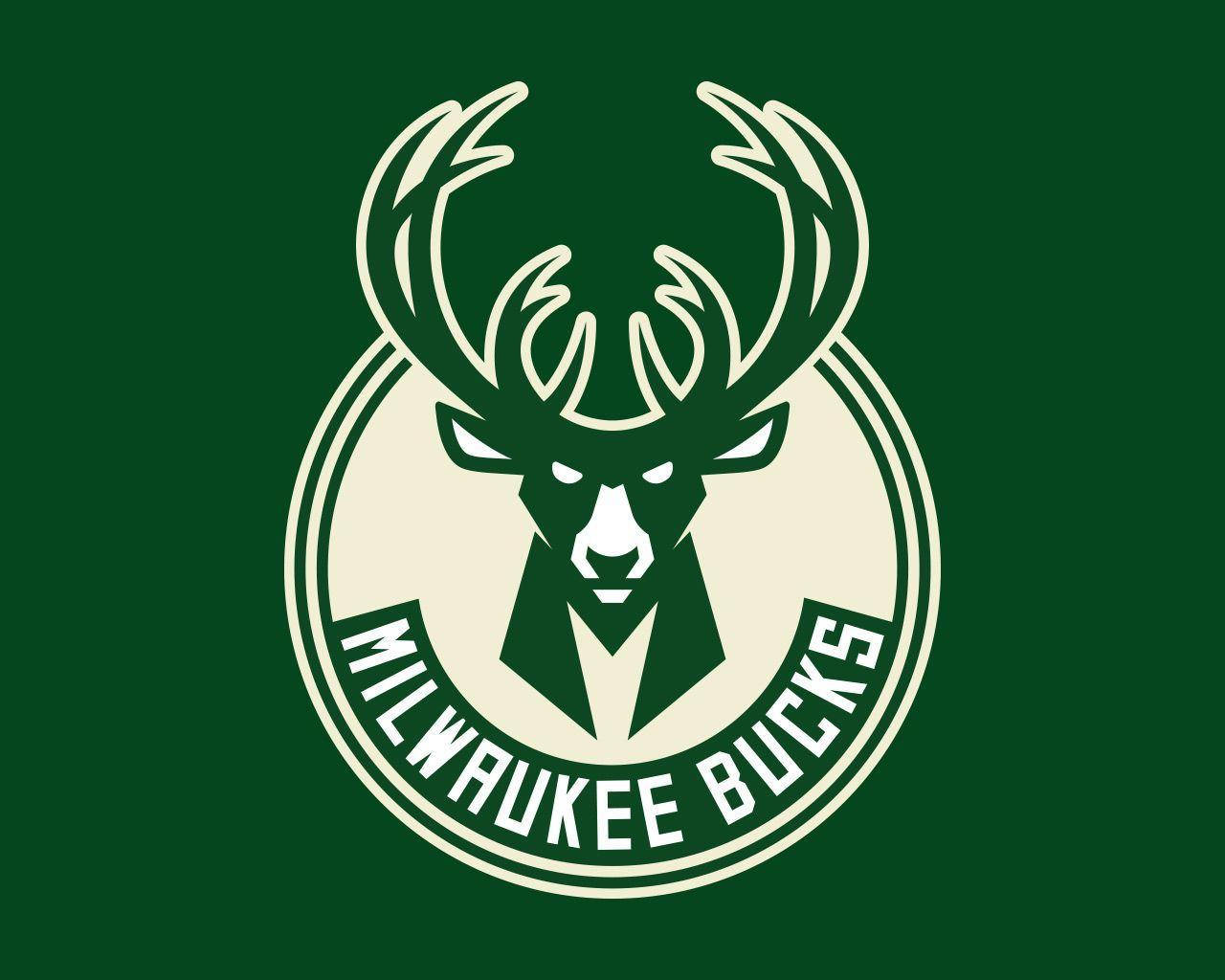 Prided Milwaukee Bucks Green Flag Waving Strong Against Clear Sky Wallpaper