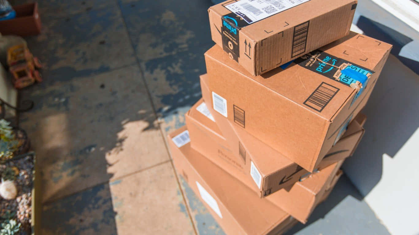 Prime Day Delivery Packages Stacked Outside Wallpaper