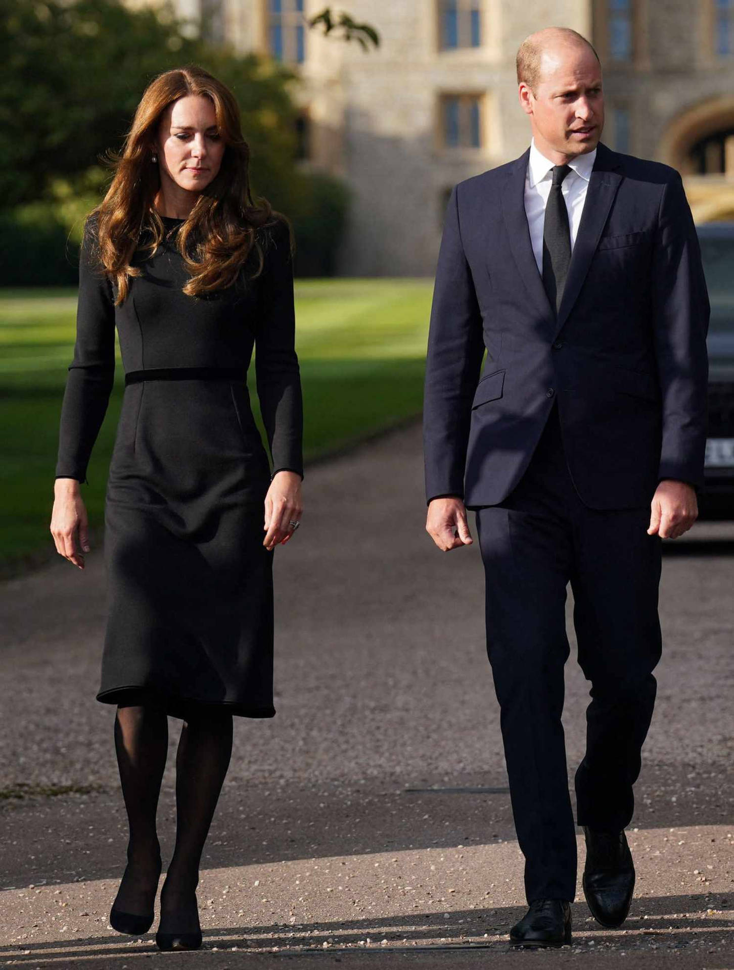 Kate And William Walk Past A Car In Front Of A Castle Wallpaper
