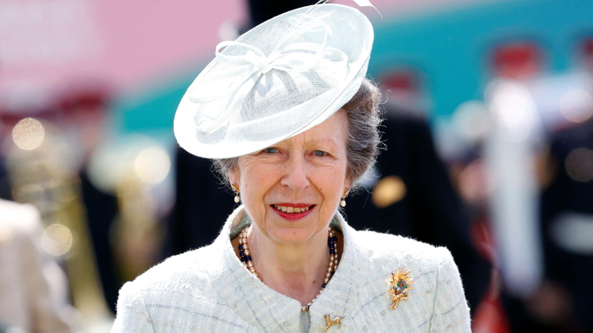 Princess Anne Adorned in Graceful All-White Outfit Wallpaper