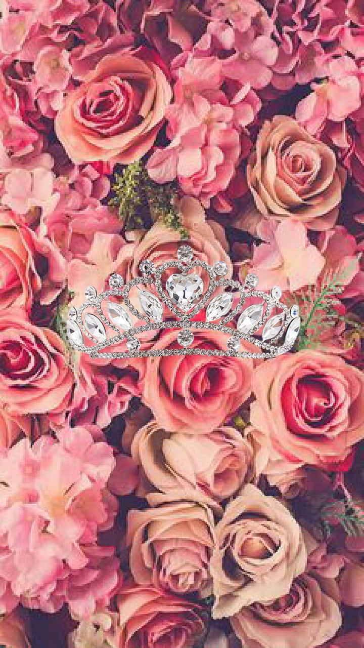 A Tiara With Pink Flowers On It Wallpaper