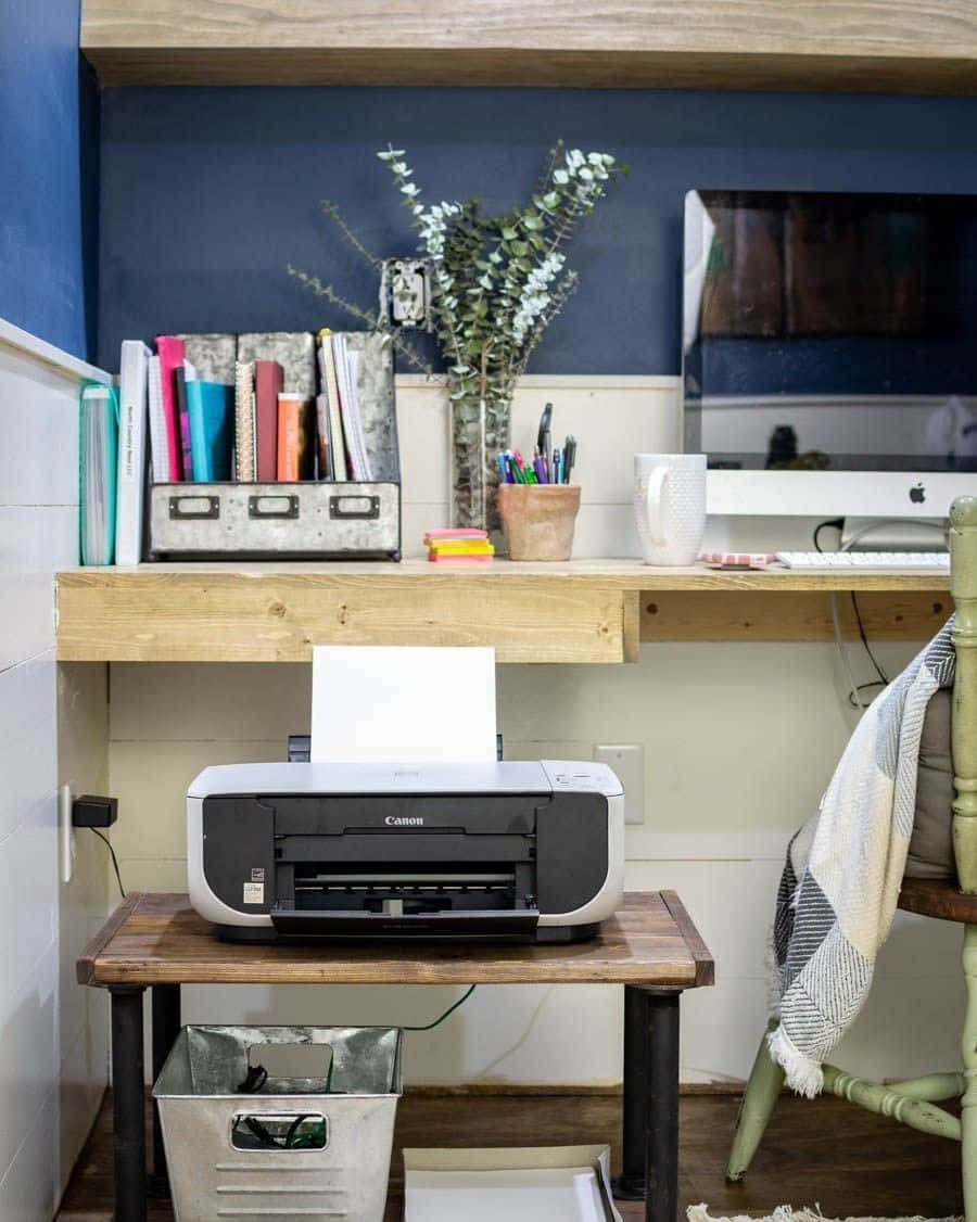 A Home Office With A Printer And A Desk Wallpaper