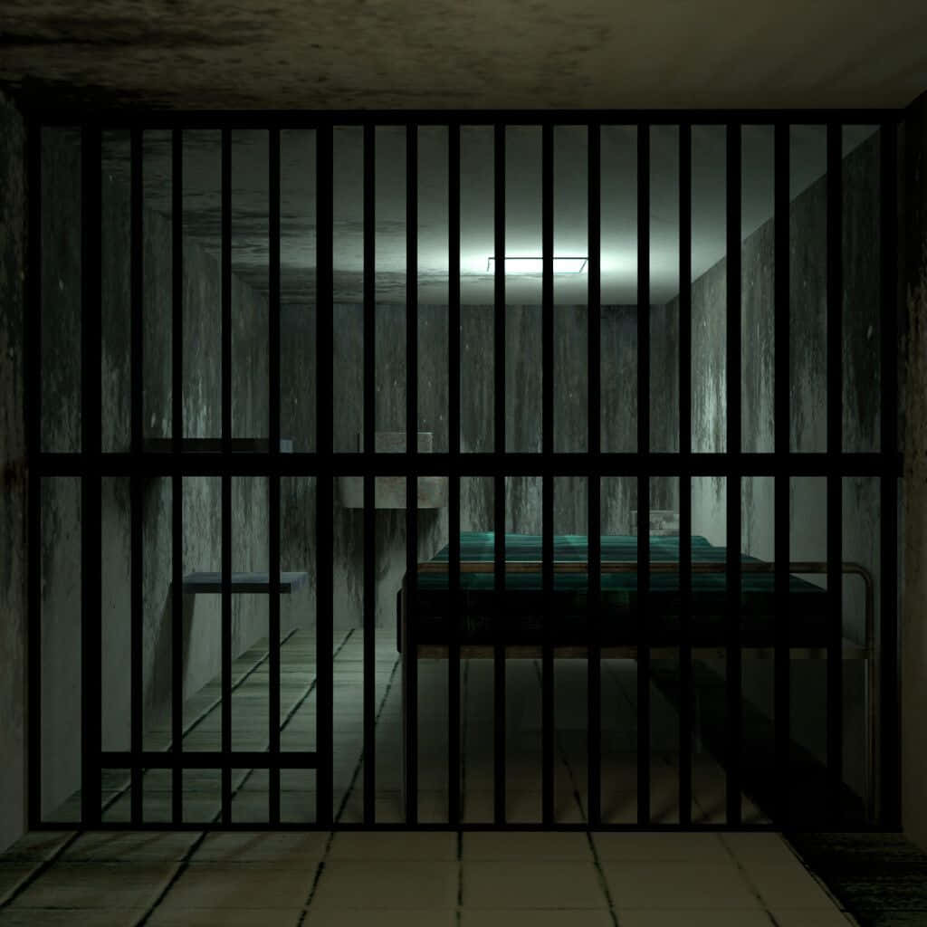 Enfängelsecell Med En Säng Och Ett Nattduksbord