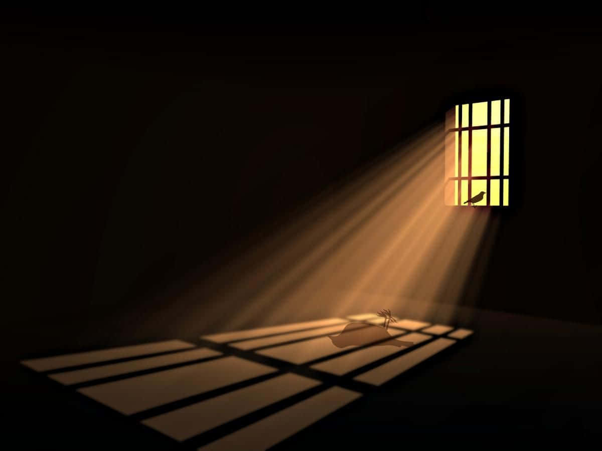A Prison Cell With A Light Shining Through The Window