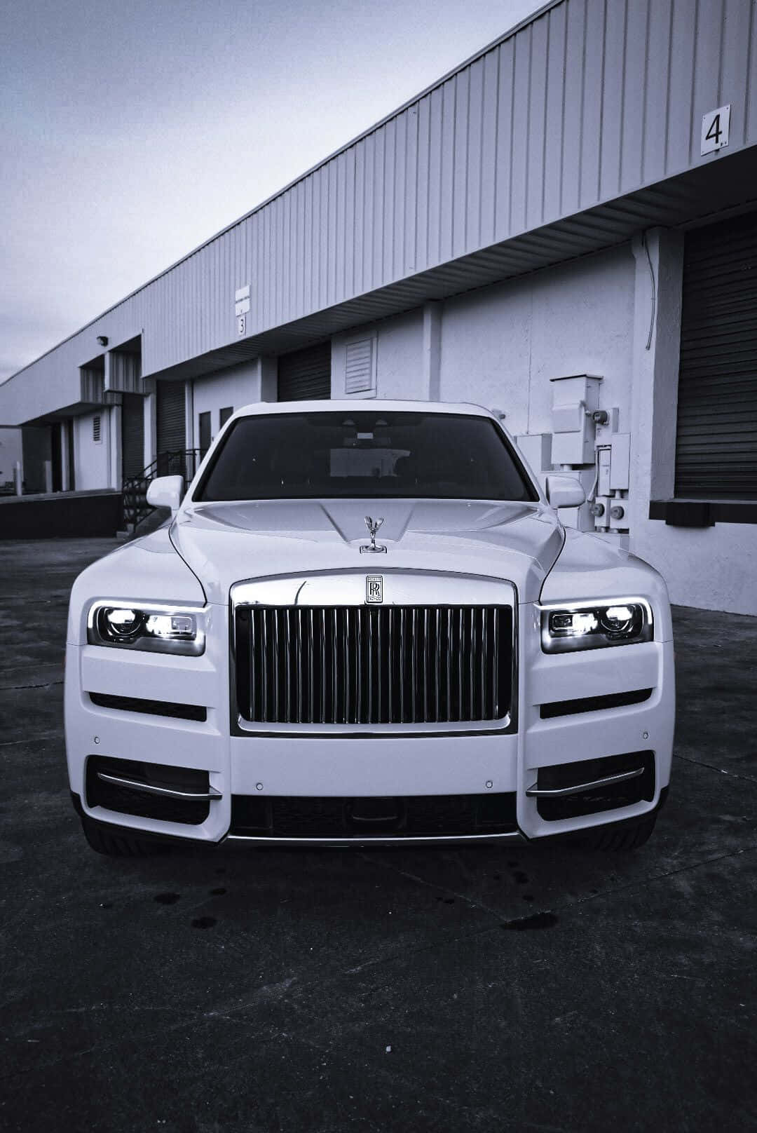 Pristine And Classy Rolls Royce Camargue Under The Blue Sky Wallpaper