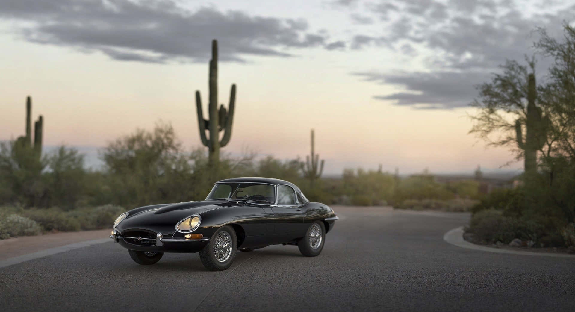 Pristine Jaguar E-type On A Scenic Route Wallpaper