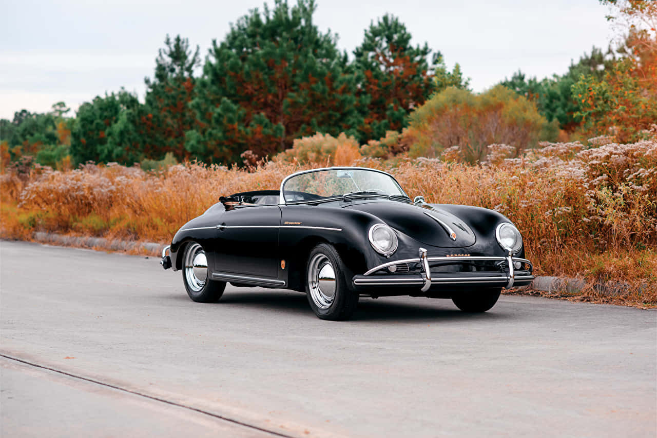 Pristine Porsche 356 Parked Scenic Vista Wallpaper