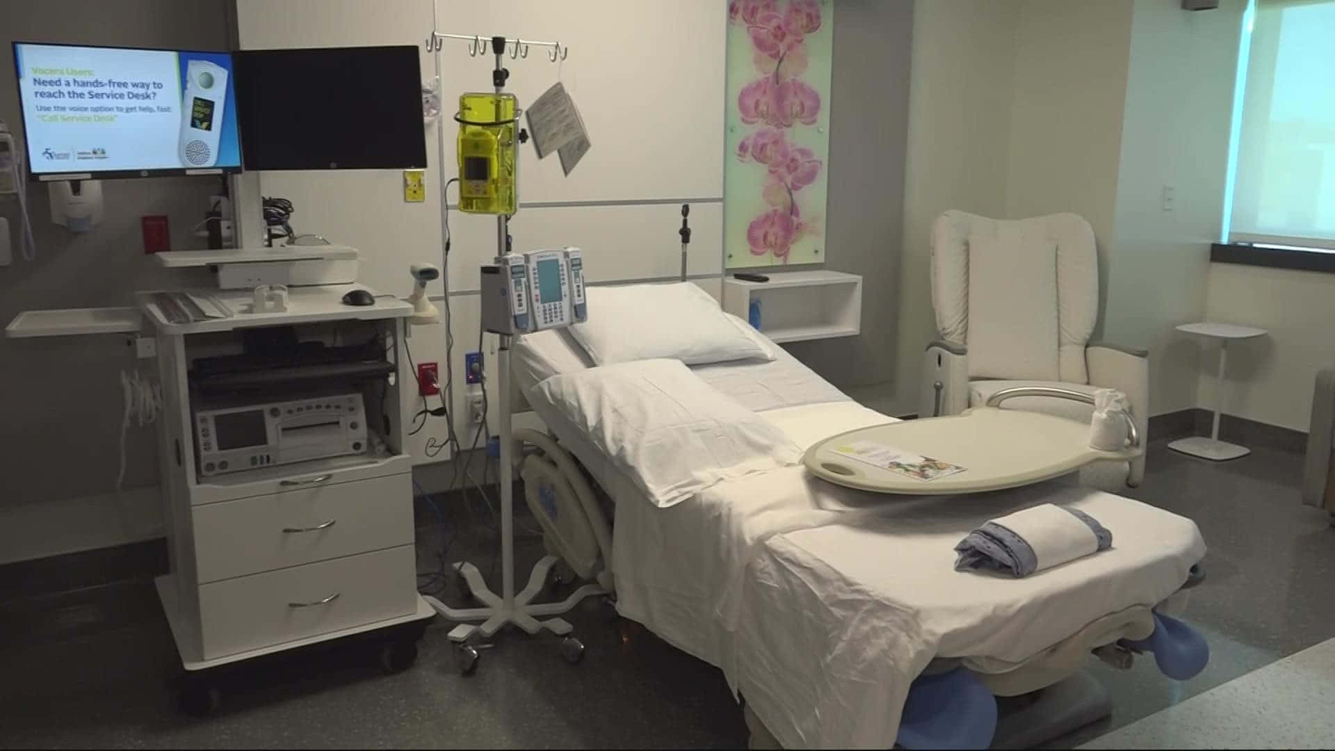 "Modern private hospital bed equipped with TV" Wallpaper