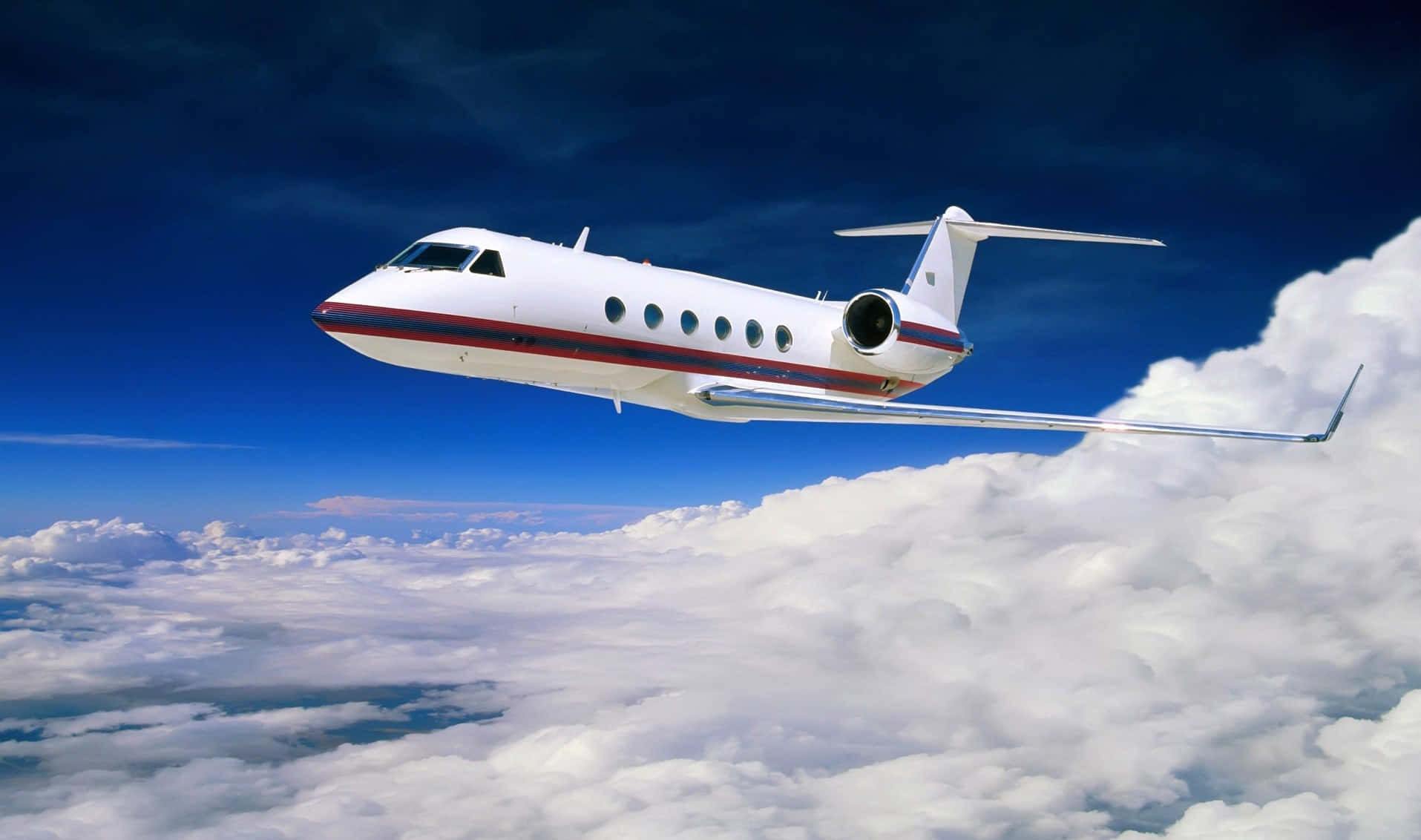 Private Jet Over Clouds Wallpaper