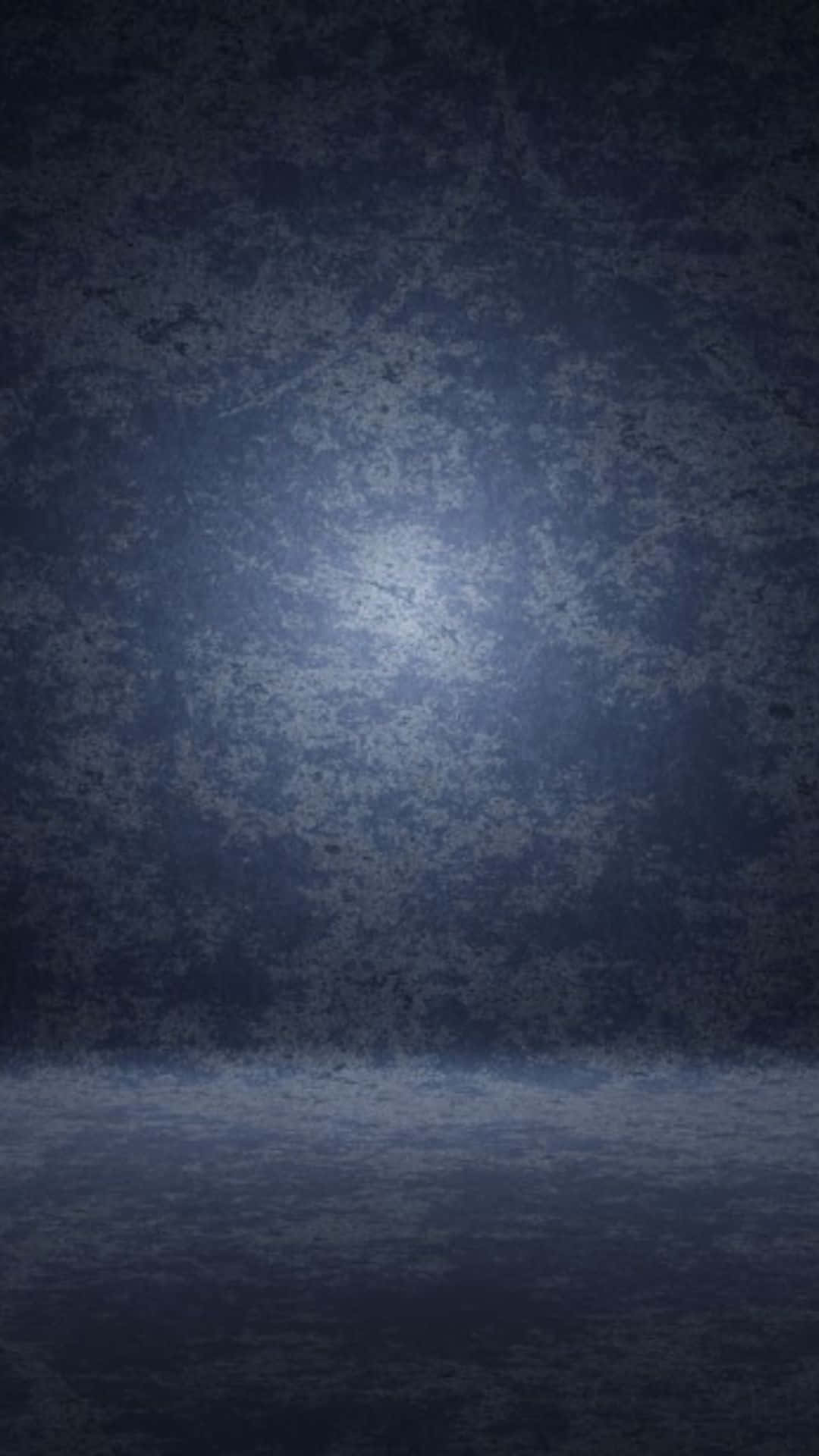 A Dark Blue Background With A Light Shining On It