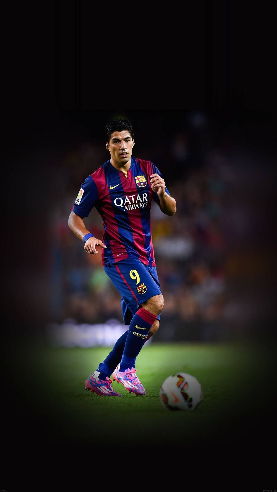 Professional Soccer Player Striding on the Field Wallpaper