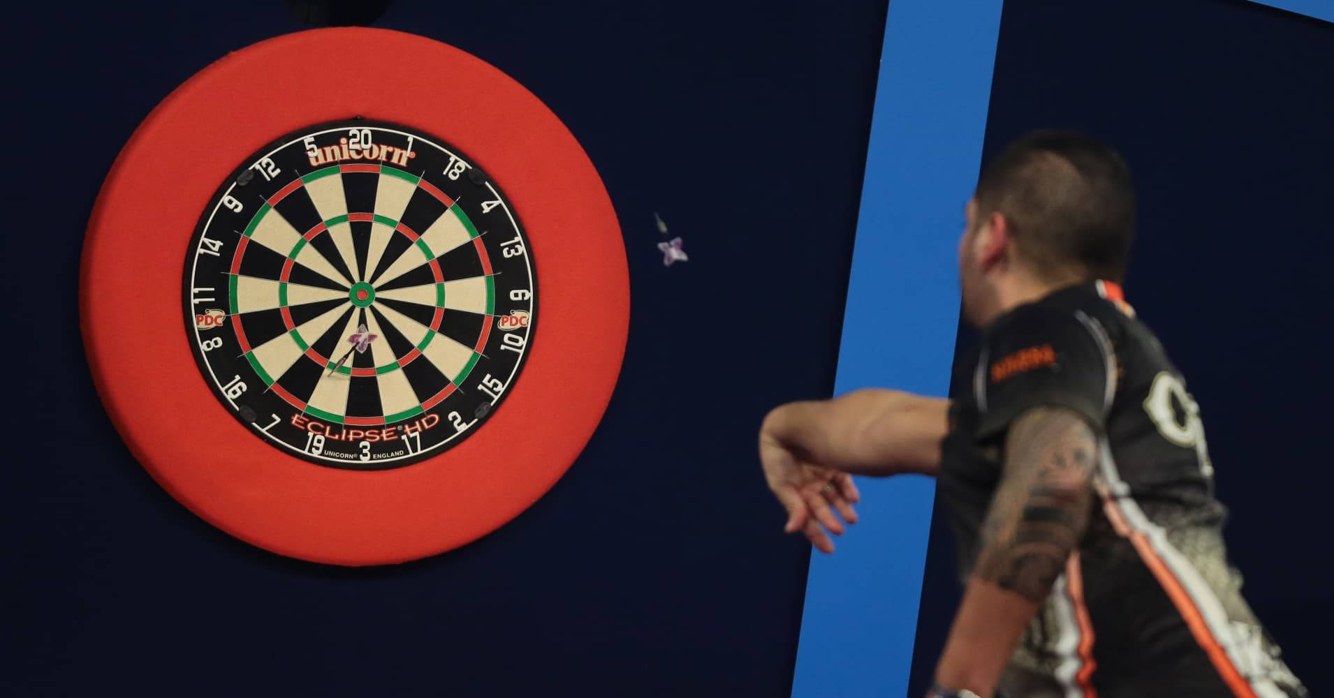 Professional Darts Player in Action Wallpaper