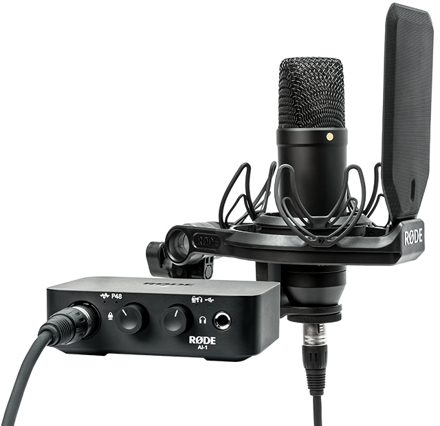 Professional Studio Microphone Setup PNG — Professional black Rode microphone and audio interface setup against a clean white background.