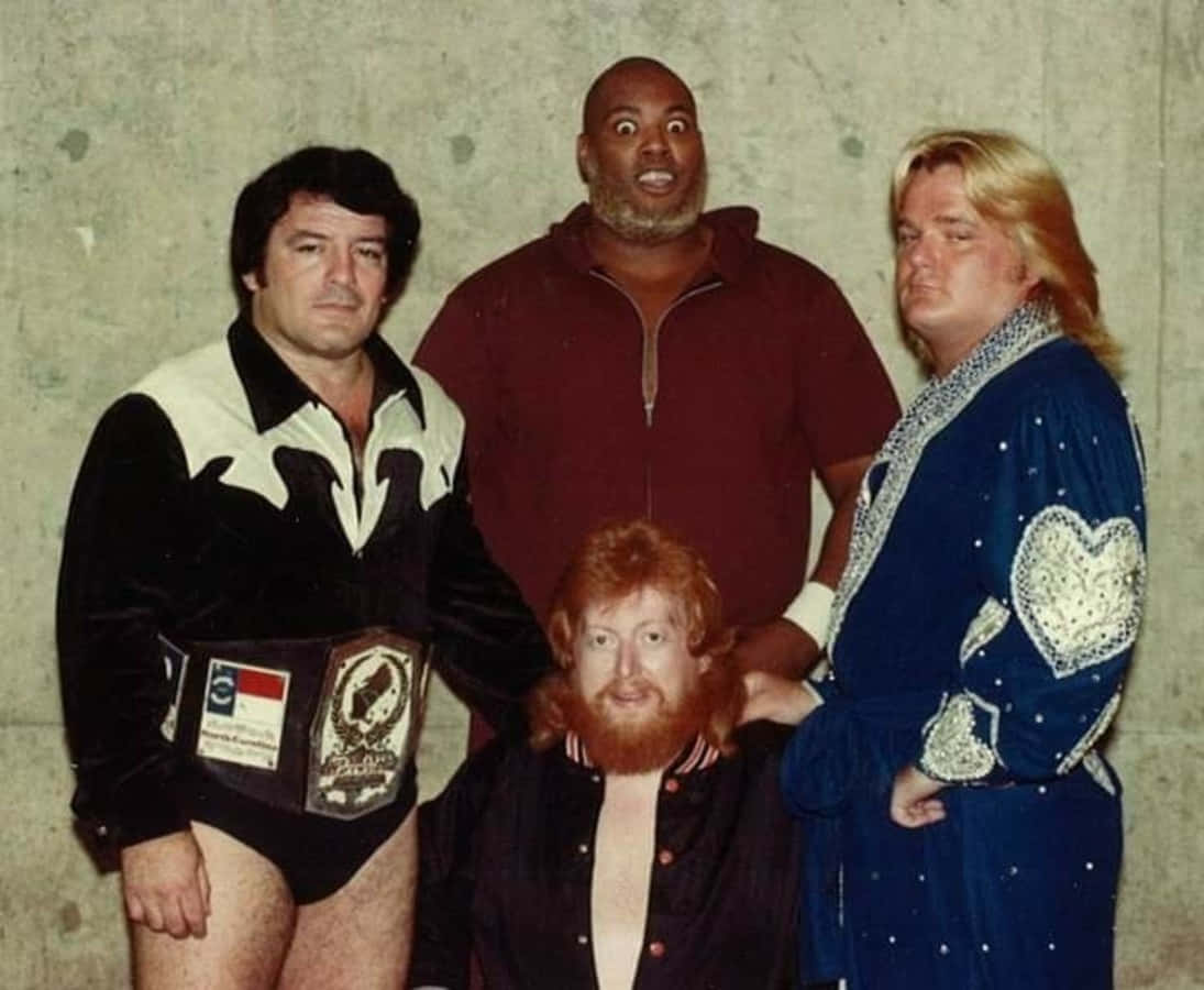 Professional Wrestler Leroy Brown With Fellow Wrestlers Wallpaper