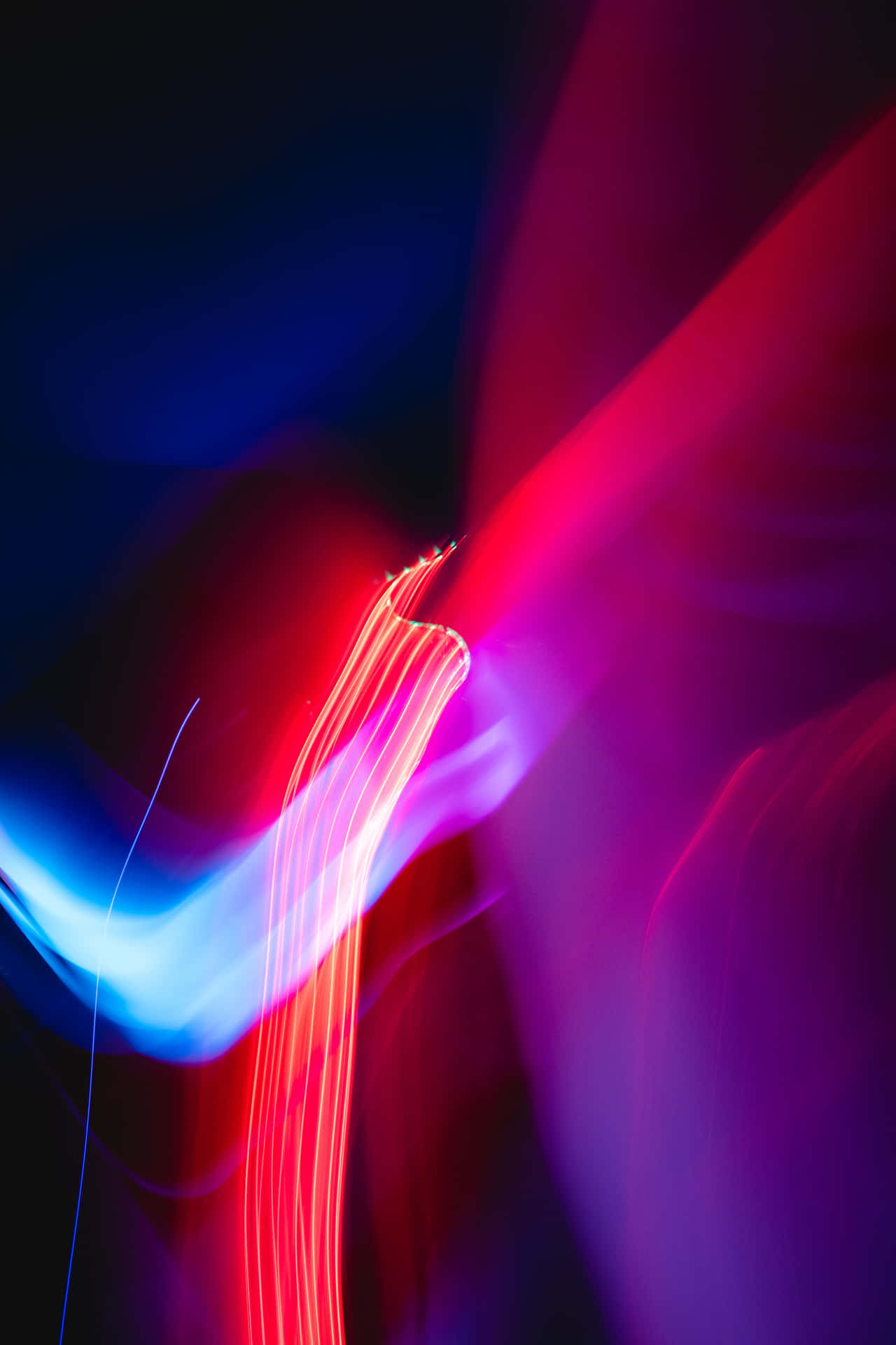 Vibrant Psychedelic Neon Lights Illuminating the Dark Wallpaper