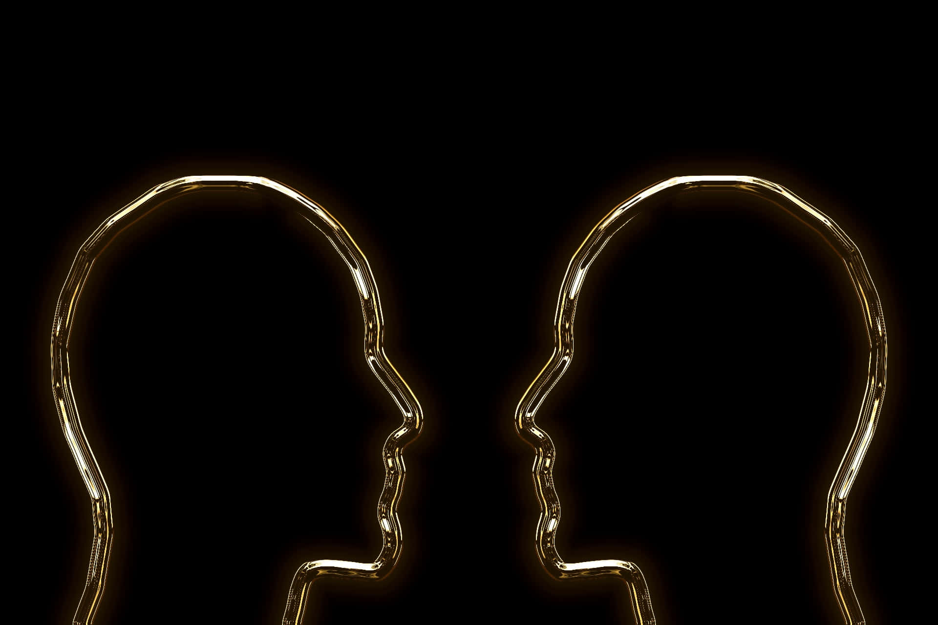 Two Golden Heads In Silhouette On A Black Background