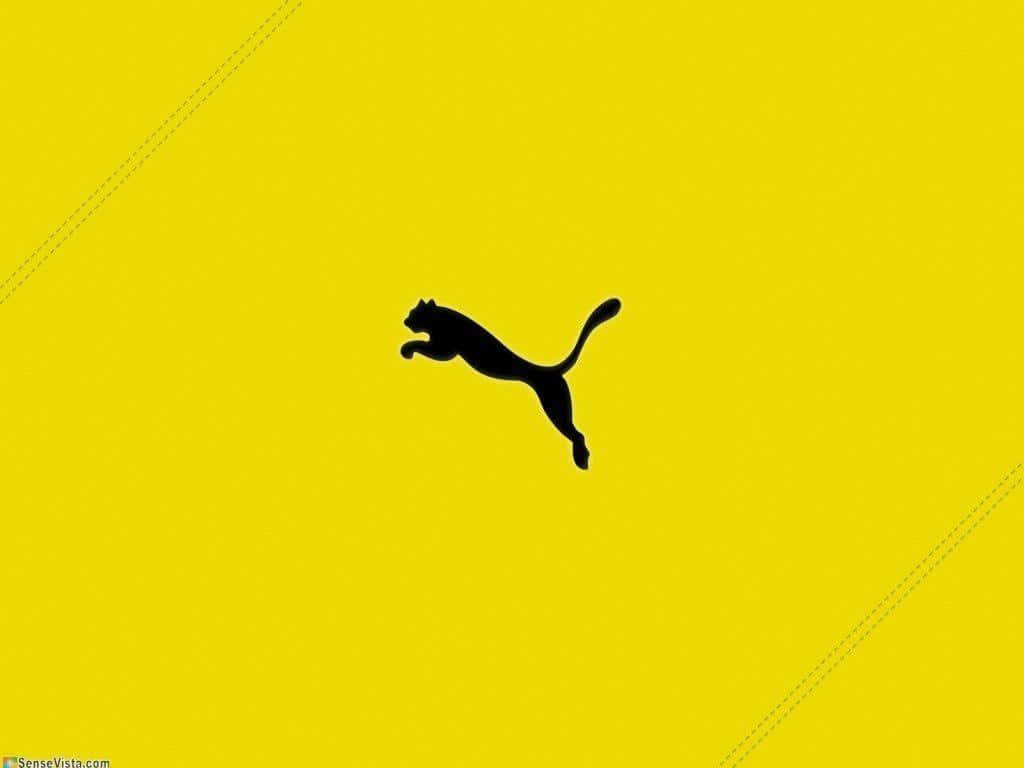 Puma Logoon Yellow Background Wallpaper