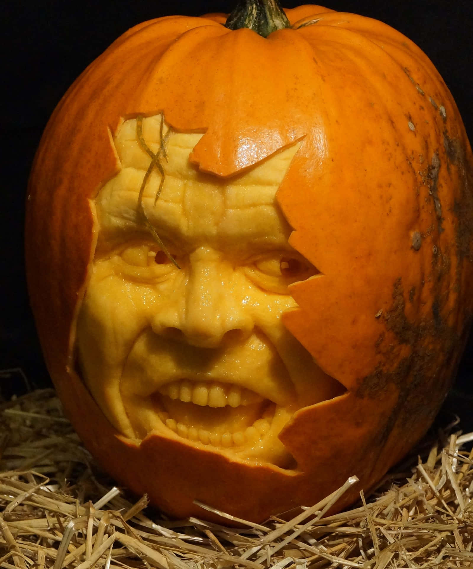 A Pumpkin With A Face Carved Into It