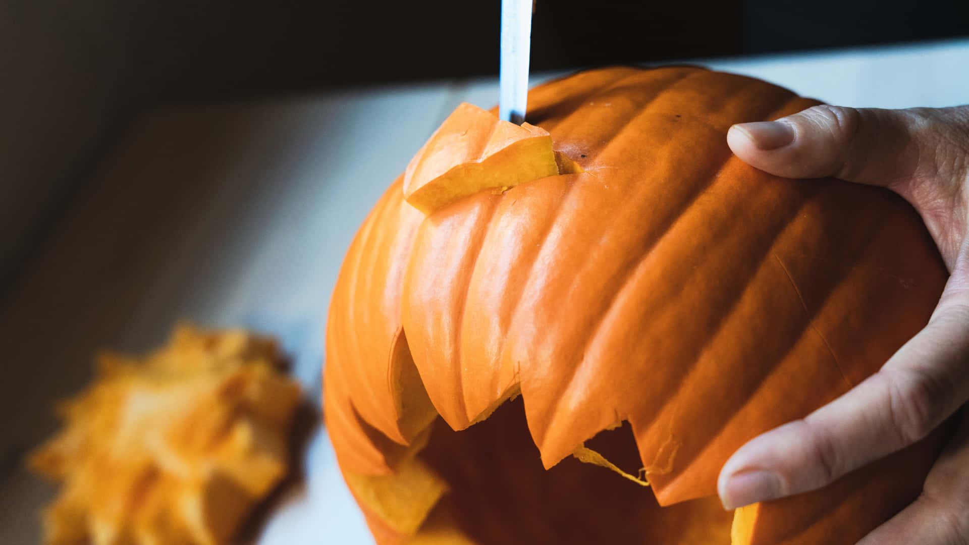 Download Pumpkin Carving With Knife Pictures | Wallpapers.com